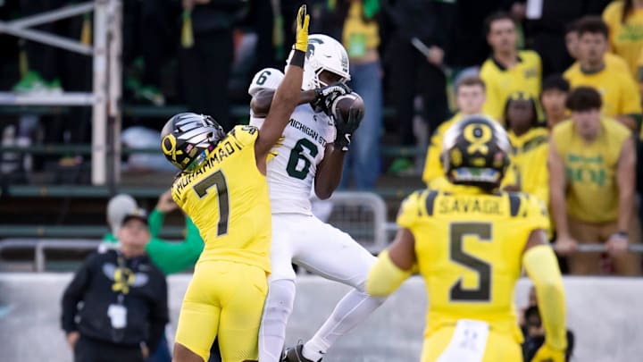 Michigan State Spartans wide receiver Nick Marsh hauls in a pass under coverage from Oregon Ducks defensive back Jabbar Muhammad as the Ducks host the Spartans Friday, Oct. 4, 2024 at Autzen Stadium in Eugene, Ore.