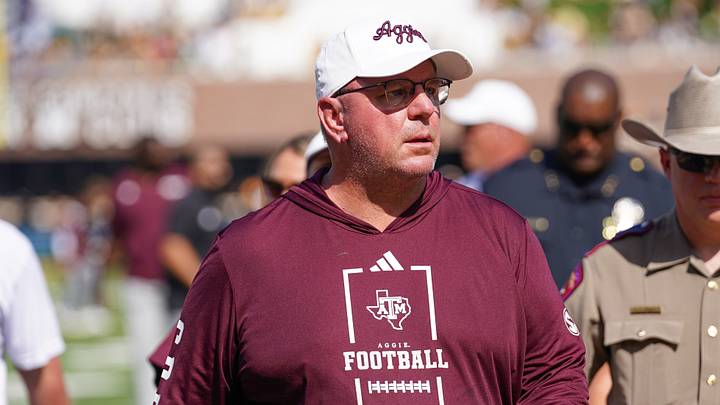 Texas A&M Aggies head coach Mike Elko leaves the field after the first half against the Missouri Tigers during the first half of the game at Faurot Field at Memorial Stadium. Texas A&M Aggies head coach Mike Elko leaves the field after the first half against the Missouri Tigers during the first half of the game at Faurot Field at Memorial Stadium.