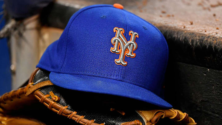 Jul 13, 2019; Miami, FL, USA; A general view of a New York Mets hat and glove on the steps of the dugout in the game between the Miami Marlins and the New York Mets at Marlins Park. Mandatory Credit: Jasen Vinlove-Imagn Images