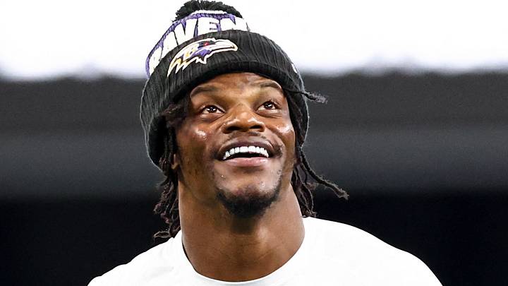 Baltimore Ravens quarterback Lamar Jackson warms up before the game against the Dallas Cowboys.