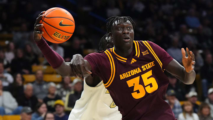 Feb 7, 2026; Boulder, Colorado, USA; Colorado Buffaloes forward Bangot Dak (8) fouls Arizona State Sun Devils center Massamba Diop (35) in the first half at the CU Events Center. Mandatory Credit: Ron Chenoy-Imagn Images