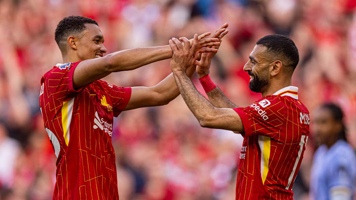 Mohamed Salah (right) starred all season long for Liverpool on their road to the Premier League title.