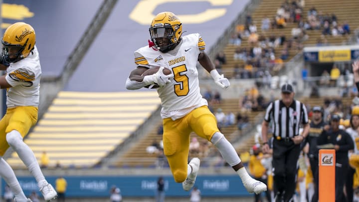 September 16, 2023; Berkeley, California, USA; Idaho Vandals running back Anthony Woods (5) scores a touchdown against the California Golden Bears during the first quarter at California Memorial Stadium. Mandatory Credit: Kyle Terada-Imagn Images September 16, 2023; Berkeley, California, USA; Idaho Vandals running back Anthony Woods (5) scores a touchdown against the California Golden Bears during the first quarter at California Memorial Stadium. Mandatory Credit: Kyle Terada-Imagn Images