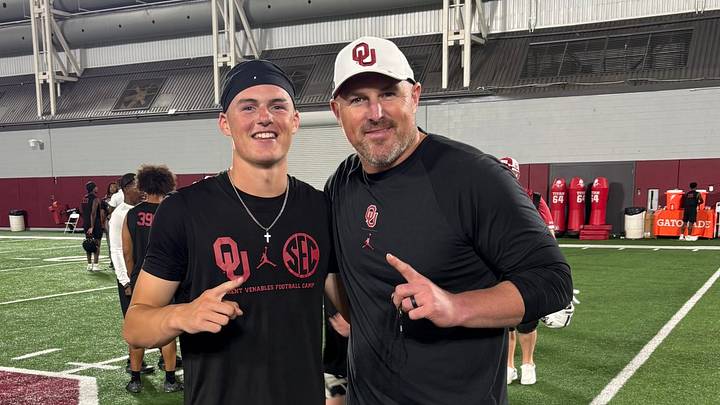 Oklahoma tight end prospect Wyatt Cordray poses with tight ends coach Jason Witten after one of the Brent Venables Football Camps.