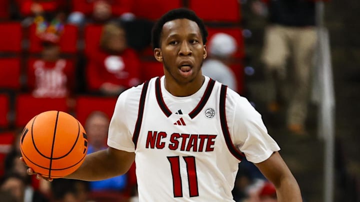 Dec 6, 2025; Raleigh, North Carolina, USA;  NC State Wolfpack guard Quadir Copeland (11) dribbles the ball during the first half of the game against UNC Asheville Bulldogs at Lenovo Center. Mandatory Credit: Jaylynn Nash-Imagn Images