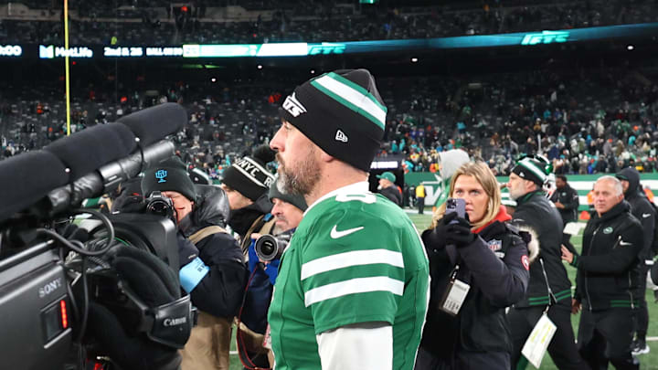 New York Jets quarterback Aaron Rodgers (8) walks on the field after the Jets win over the Miami Dolphins at MetLife Stadium. 