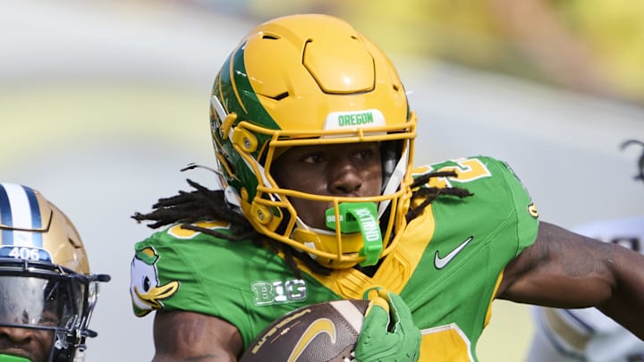 Aug 30, 2025; Eugene, Oregon, USA; Oregon Ducks running back Dierre Hill Jr. (23) runs with the ball during the second half against Montana State Bobcats defensive back Carson Williams (8) at Autzen Stadium. Mandatory Credit: Troy Wayrynen-Imagn Images