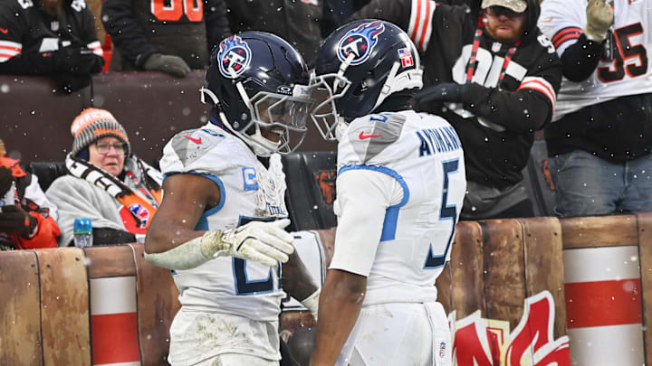 Dec 7, 2025; Cleveland, Ohio, USA; Fans react as Tennessee Titans running back Tony Pollard (20) celebrates with wide receiver Elic Ayomanor (5) after scoring a touchdown against the Cleveland Browns during the third quarter at Huntington Bank Field. Mandatory Credit: Ken Blaze-Imagn Images Dec 7, 2025; Cleveland, Ohio, USA; Fans react as Tennessee Titans running back Tony Pollard (20) celebrates with wide receiver Elic Ayomanor (5) after scoring a touchdown against the Cleveland Browns during the third quarter at Huntington Bank Field. Mandatory Credit: Ken Blaze-Imagn Images
