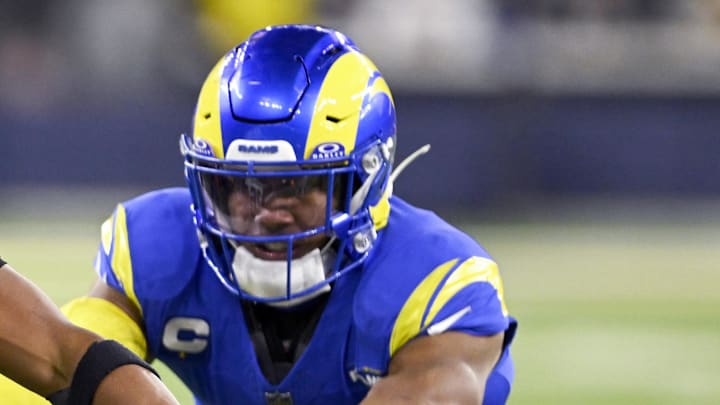 Nov 24, 2024; Inglewood, California, USA;  Philadelphia Eagles running back Saquon Barkley (26) runs past Los Angeles Rams safety Quentin Lake (right) during the second half at SoFi Stadium. Mandatory Credit: Alex Gallardo-Imagn Images