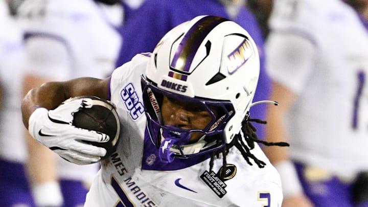 Dec 20, 2025; Eugene, OR, USA; James Madison Dukes running back Wayne Knight (3) rushes during the second quarter against the Oregon Ducks at Autzen Stadium. Mandatory Credit: Troy Wayrynen-Imagn Images