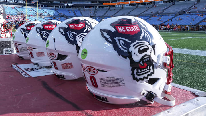 Sep 7, 2024; Charlotte, North Carolina, USA; North Carolina State Wolfpack helmets during pregame activity for the Dukes Mayo Classic against the Tennessee Volunteers at Bank of America Stadium. Mandatory Credit: Jim Dedmon-Imagn Images Sep 7, 2024; Charlotte, North Carolina, USA; North Carolina State Wolfpack helmets during pregame activity for the Dukes Mayo Classic against the Tennessee Volunteers at Bank of America Stadium. Mandatory Credit: Jim Dedmon-Imagn Images