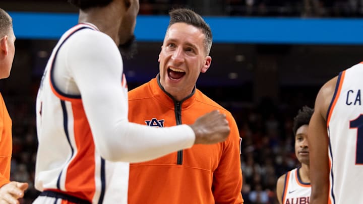 Auburn Tigers head coach Steven Pearl celebrates with guard Kevin Overton as the Tigers beat the Longhorns. Auburn Tigers head coach Steven Pearl celebrates with guard Kevin Overton as the Tigers beat the Longhorns.