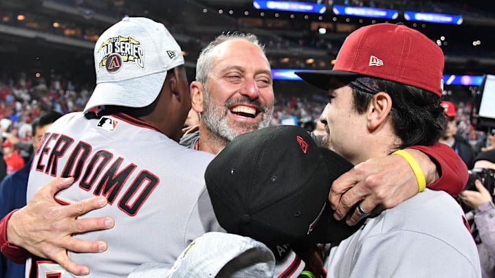 Oct 24, 2023; Philadelphia, Pennsylvania, USA; Arizona Diamondbacks manager Torey Lovullo (17), left fielder Corbin Carroll (7) and shortstop Geraldo Perdomo (2) react after defeating the Philadelphia Phillies in game seven of the NLCS for the 2023 MLB playoffs at Citizens Bank Park. Mandatory Credit: Eric Hartline-Imagn Images Oct 24, 2023; Philadelphia, Pennsylvania, USA; Arizona Diamondbacks manager Torey Lovullo (17), left fielder Corbin Carroll (7) and shortstop Geraldo Perdomo (2) react after defeating the Philadelphia Phillies in game seven of the NLCS for the 2023 MLB playoffs at Citizens Bank Park. Mandatory Credit: Eric Hartline-Imagn Images