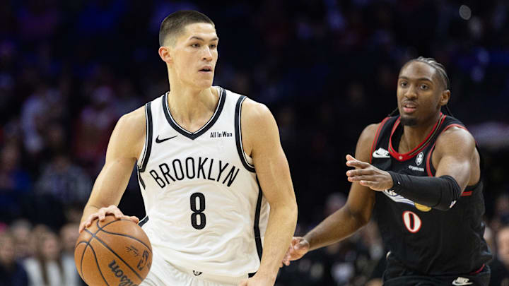Dec 23, 2025; Philadelphia, Pennsylvania, USA; Brooklyn Nets guard Egor Demin (8) dribbles front of Philadelphia 76ers guard Tyrese Maxey (0) during the first quarter at Xfinity Mobile Arena. Mandatory Credit: Bill Streicher-Imagn Images