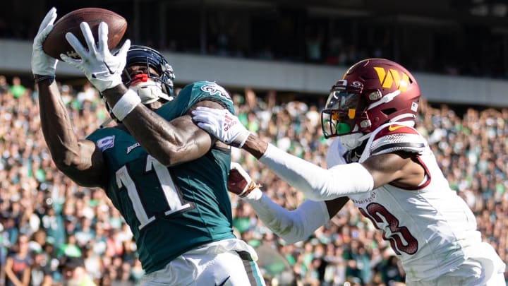 Oct 1, 2023; Philadelphia, Pennsylvania, USA; Philadelphia Eagles wide receiver A.J. Brown (11) catches a touchdown pass past Washington Commanders cornerback Emmanuel Forbes (13) during the fourth quarter at Lincoln Financial Field. Mandatory Credit: Bill Streicher-USA TODAY Sports