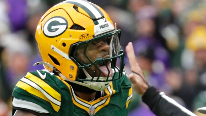 Green Bay Packers defensive end Micah Parsons (1) celebratess sacking Minnesota Vikings quarterback J.J. McCarthy.