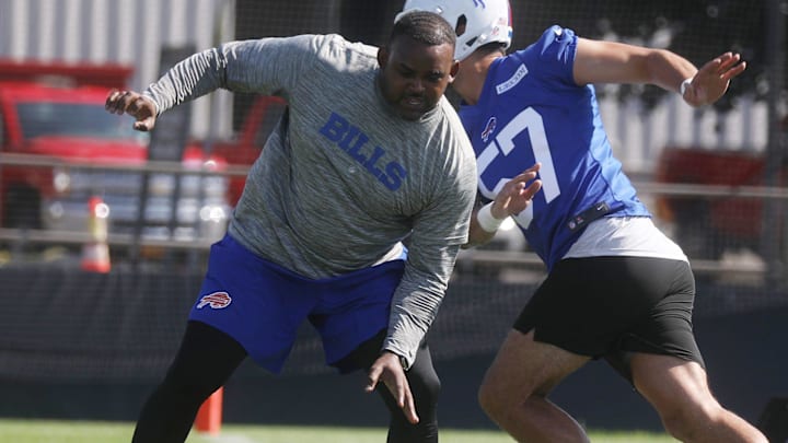 Defensive Line Coach Marcus West forces Bills A.J. Epenesa to go around him during a drill. Defensive Line Coach Marcus West forces Bills A.J. Epenesa to go around him during a drill.