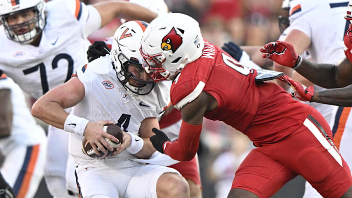 Oct 4, 2025; Louisville, Kentucky, USA; Louisville Cardinals linebacker Antonio Watts (9) sacks Virginia Cavaliers quarterback Chandler Morris (4) during the second half at L&N Federal Credit Union Stadium. Virginia defeated Louisville 30-27. Mandatory Credit: Jamie Rhodes-Imagn Images