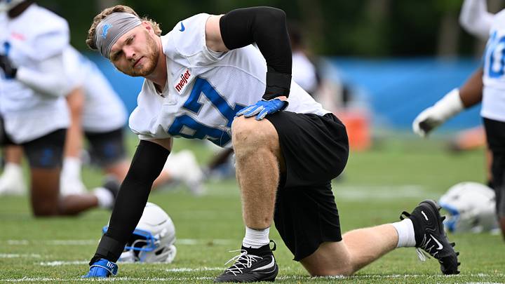 Jun 17, 2026; Detroit, MI, USA; Detroit Lions defensive end Aidan Hutchinson (97) stretches during the Detroit Lions veteran’s minicamp at the Allen Park Training Facility. Mandatory Credit: Lon Horwedel-Imagn Images Jun 17, 2026; Detroit, MI, USA; Detroit Lions defensive end Aidan Hutchinson (97) stretches during the Detroit Lions veteran’s minicamp at the Allen Park Training Facility. Mandatory Credit: Lon Horwedel-Imagn Images