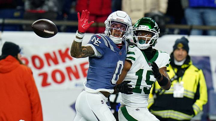 Nov 13, 2025; Foxborough, Massachusetts, USA; New England Patriots Christian Gonzalez cornerback (0) defends against New York Jets wide receiver Adonai Mitchell (15) in the fourth quarter at Gillette Stadium. Mandatory Credit: David Butler II-Imagn Images Nov 13, 2025; Foxborough, Massachusetts, USA; New England Patriots Christian Gonzalez cornerback (0) defends against New York Jets wide receiver Adonai Mitchell (15) in the fourth quarter at Gillette Stadium. Mandatory Credit: David Butler II-Imagn Images