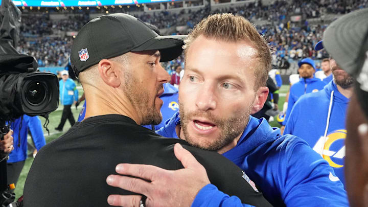 Jan 10, 2026; Charlotte, NC, USA; Los Angeles Rams head coach Sean McVay and Carolina Panthers head coach Dave Canales meet after the game in the NFC Wild Card Round game at Bank of America Stadium. Mandatory Credit: Bob Donnan-Imagn Images
