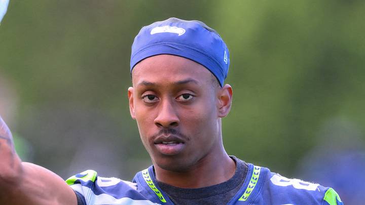 Seattle Seahawks wide receiver Ricky White III throws the ball