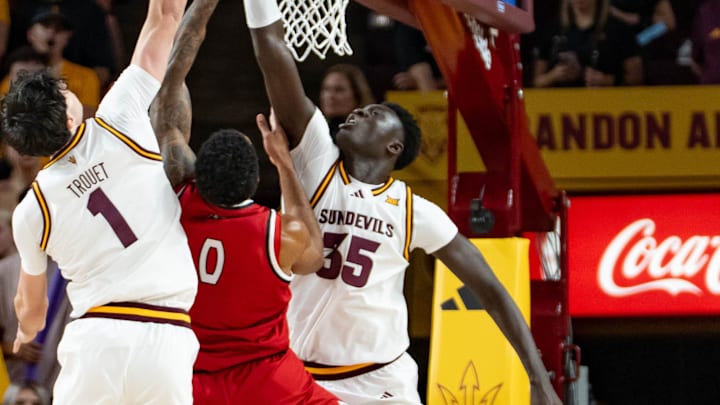 Arizona State Sun Devils Santiago Trouet (1) and Massamba Diop (35) attempt to block Southern Utah Thunderbirds Isaiah Cottrell (0) during a game at Desert Financial Arena in Tempe on Nov. 4, 2025.
