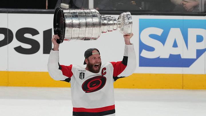 Jun 14, 2026; Las Vegas, Nevada, USA; Carolina Hurricanes center Jordan Staal (11) raises the the Stanley Cup after defeating the Vegas Golden Knights in game six of the 2026 Stanley Cup Final at T-Mobile Arena. Mandatory Credit: Lucas Peltier-Imagn Images