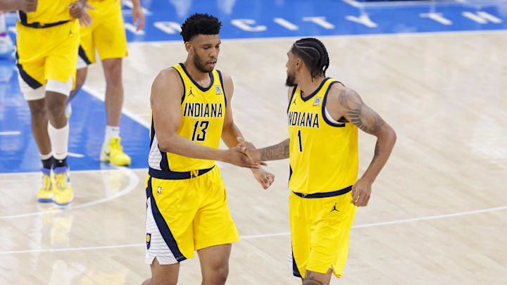 Jun 16, 2025; Oklahoma City, Oklahoma, USA; Indiana Pacers forward Obi Toppin (1) and center Tony Bradley (13) celebrate during the second quarter against the Oklahoma City Thunder in game five of the 2025 NBA Finals at Paycom Center. Mandatory Credit: Alonzo Adams-Imagn Images