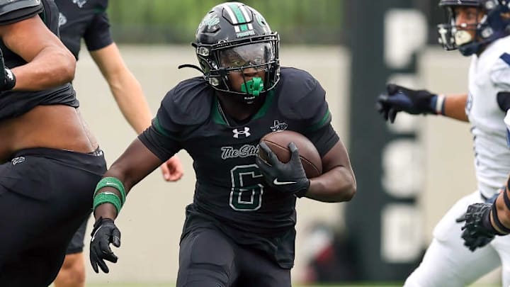 Prosper's Josh Martinez is shown carrying the ball in a game against Allen. Prosper beat Princeton in Week 10. 