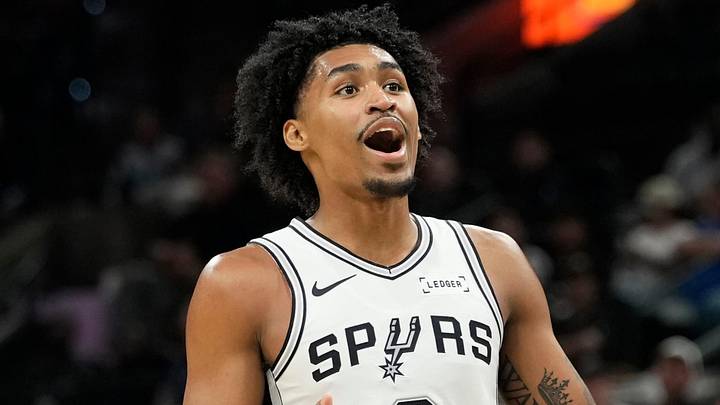 Oct 10, 2025; San Antonio, Texas, USA; San Antonio Spurs guard Dylan Harper (2) reacts after making an alley-oop pass to forward Victor Wembanyama (1) during the first half against the Utah Jazz at Frost Bank Center. Mandatory Credit: Scott Wachter-Imagn Images