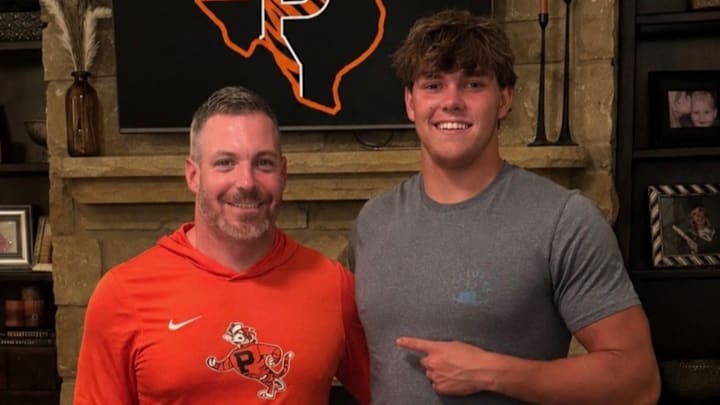 Austin Moilan and Princeton inside linebackers' coach Mike Weick