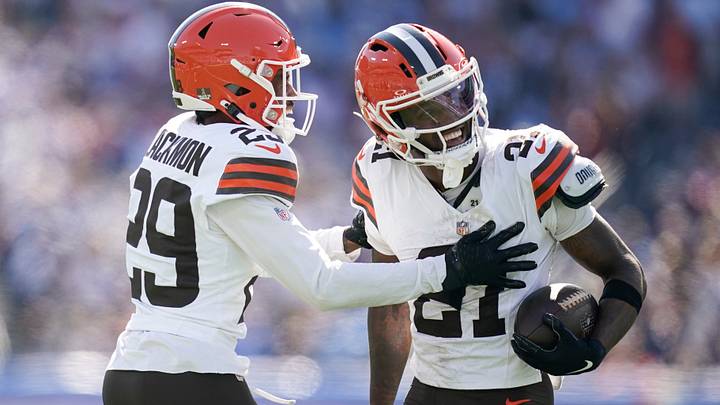 Cleveland Browns cornerback Denzel Ward, right, celebrates intercepting a Tennessee Titans pass.