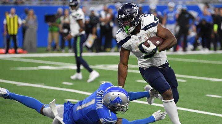 Sep 17, 2023; Detroit, Michigan, USA; Seattle Seahawks running back Kenneth Walker III (9) breaks a tackle from Detroit Lions cornerback Cameron Sutton (1) in the third quarter at Ford Field. Mandatory Credit: Lon Horwedel-USA TODAY Sports