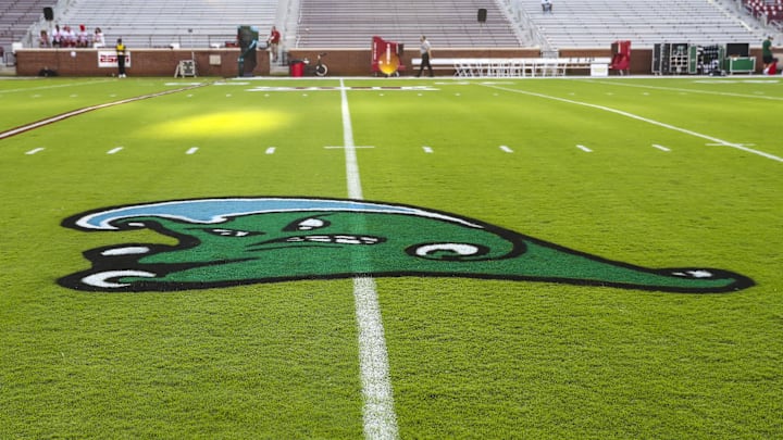 Sep 4, 2021; Norman, Oklahoma, USA;  The logo of the Tulane Green Wave is displayed on the field before the game against the Oklahoma Sooners at Gaylord Family-Oklahoma Memorial Stadium.