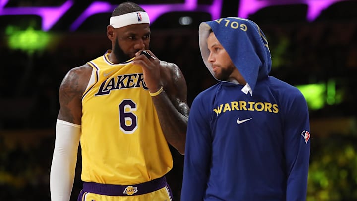 Oct 19, 2021; Los Angeles, California, USA; Los Angeles Lakers forward LeBron James (6) talks to Golden State Warriors guard Stephen Curry (30) during the second half at Staples Center. The Warriors won 121-114. Mandatory Credit: Kiyoshi Mio-Imagn Images
