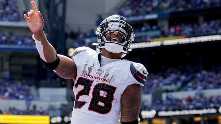 Houston Texans running back Joe Mixon (28) celebrates after scoring a touchdown Sunday, Sept. 8, 2024, during a game against the Indianapolis Colts at Lucas Oil Stadium in Indianapolis.