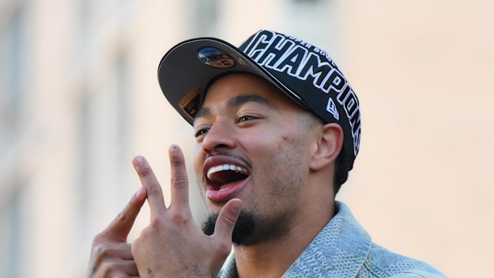 Seattle Seahawks wide receiver Jaxon Smith-Njigba interacts with fans during the Super Bowl LX World Champions parade.