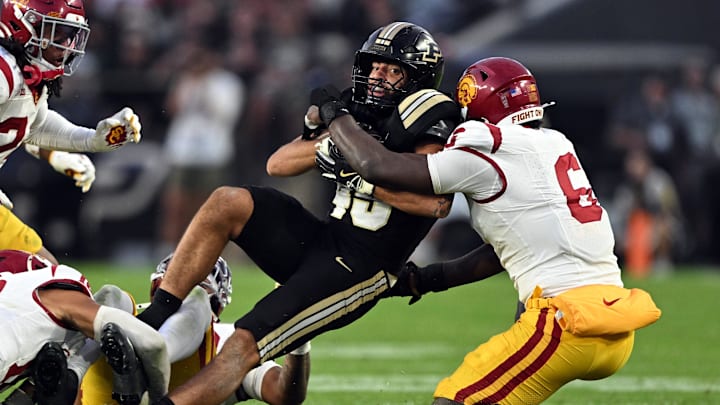 Purdue Boilermakers running back Devin Mockobee (45) is tackled 