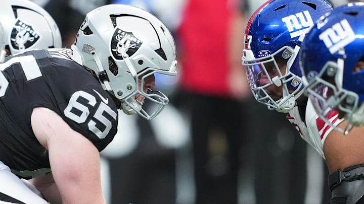 Dec 28, 2025; Paradise, Nevada, USA; Las Vegas Raiders guard Alex Cappa (65) prepares to snap the ball in the first quarter against the New York Giants at Allegiant Stadium. Mandatory Credit: Kirby Lee-Imagn Images