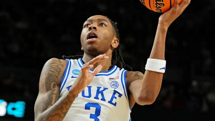 Mar 21, 2026; Greenville, SC, USA; Duke Blue Devils guard Isaiah Evans (3) drives to the basket against Texas Christian University Horned Frogs guard Jayden Pierre (1) during the first half during a second round game of the men's 2026 NCAA Tournament at Bon Secours Wellness Arena. Mandatory Credit: Bob Donnan-Imagn Images