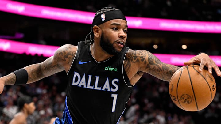 Jan 14, 2026; Dallas, Texas, USA; Dallas Mavericks guard Jaden Hardy (1) controls the loose ball in front of Denver Nuggets forward Zeke Nnaji (22) during the second half at the American Airlines Center. Mandatory Credit: Jerome Miron-Imagn Images