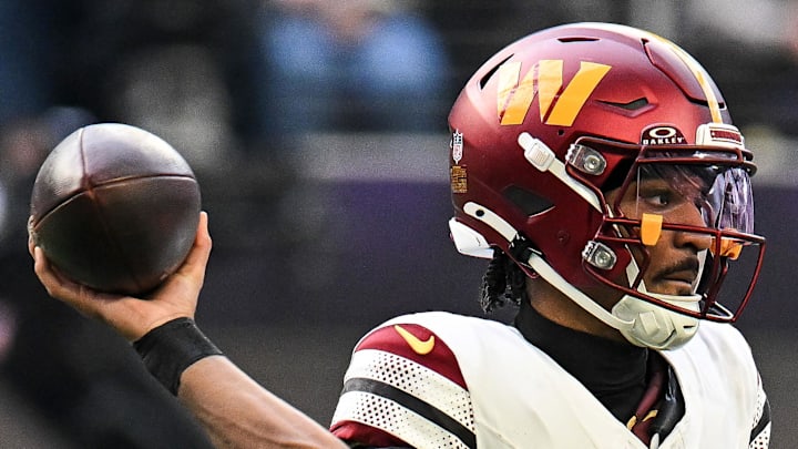 Washington Commanders quarterback Jayden Daniels drops back to pass against the Minnesota Vikings.
