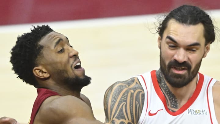 Cleveland Cavaliers guard Donovan Mitchell defends Houston Rockets center Steven Adams.