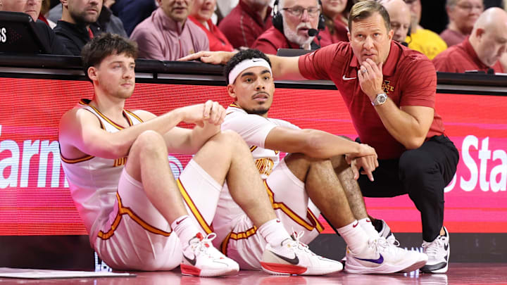 Jan 2, 2026; Ames, Iowa, USA;  Iowa State Cyclones head coach T.J. Otzelberger, guard Tamin Lipsey (3) and guard Nate Heise (0) watch the Cyclones play the West Virginia Mountaineers during the second half at James H. Hilton Coliseum. Mandatory Credit: Reese Strickland-Imagn Images