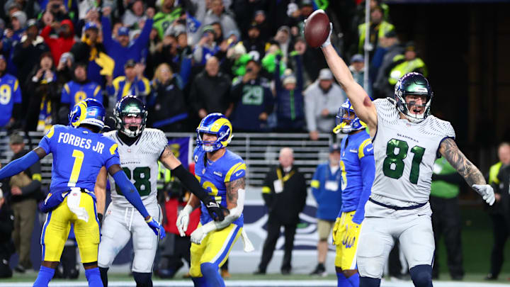 Dec 18, 2025; Seattle, Washington, USA; Seattle Seahawks tight end Eric Saubert (81) celebrates after making a catch for a game-winning two-point conversion against the Los Angeles Rams in overtime at Lumen Field. Mandatory Credit: Kevin Ng-Imagn Images
