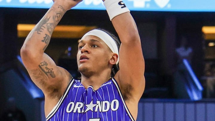 Orlando Magic forward Paolo Banchero shoots against Boston Celtics guard Derrick White.