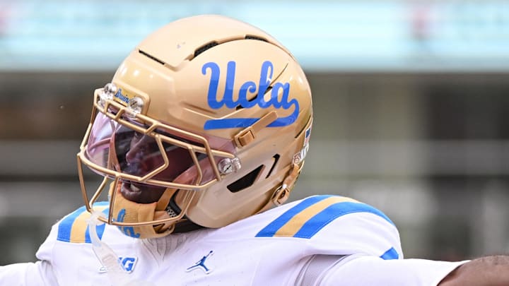 Oct 25, 2025; Bloomington, Indiana, USA; UCLA Bruins defensive back Key Lawrence (4) celebrates after a play during the first half against the Indiana Hoosiers at Memorial Stadium. Mandatory Credit: Robert Goddin-Imagn Images