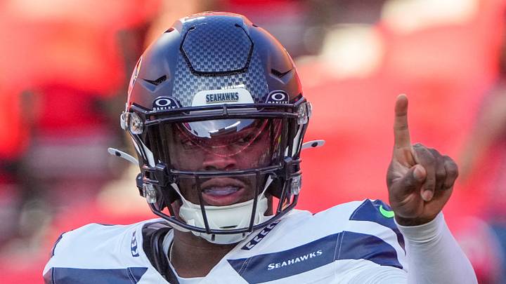 Seattle Seahawks quarterback Jalen Milroe warms up