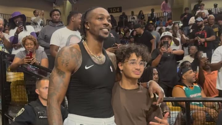 Dwight Howard takes photo with fan at BIG 3 championship game in Addition Financial Arena, Orlando, FL Dwight Howard takes photo with fan at BIG 3 championship game in Addition Financial Arena, Orlando, FL